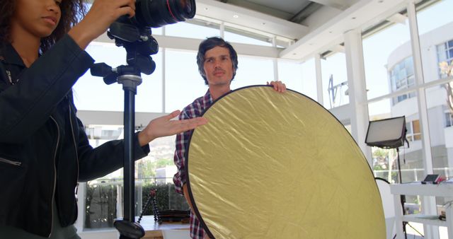 Photographer and Assistant Adjusting Lighting Equipment in Studio - Download Free Stock Images Pikwizard.com