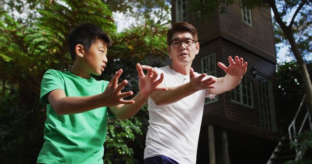 Father and Son Practicing Tai Chi in Forest - Download Free Stock Images Pikwizard.com