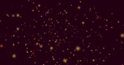 Hypnotic motion of yellow and red light spots on black background