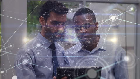 Business Professionals Exploring Digital Network With Tablet