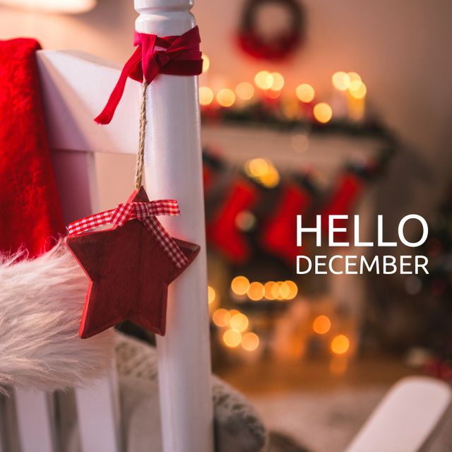 Composition of hello december text over christmas decorations. Winter and celebration concept digitally generated image.