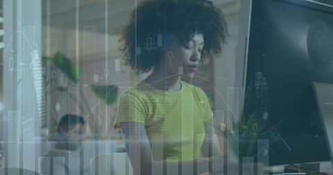 Focused Businesswoman Analyzing Digital Data Charts at Computer