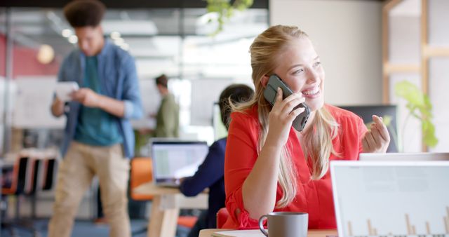 Smiling Professional Woman on Phone in Modern Office - Download Free Stock Images Pikwizard.com