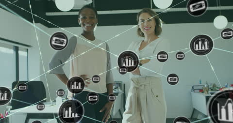 Diverse Coworkers in Modern Office Surrounded by Digital Connectivity