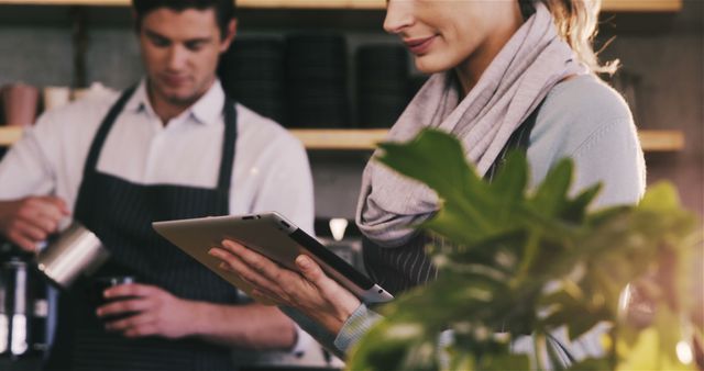 Baristas Working in Cafe Checking Orders on Tablet - Download Free Stock Images Pikwizard.com