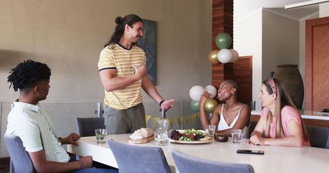 Friends Enjoying Casual Meal and Conversation Around Table