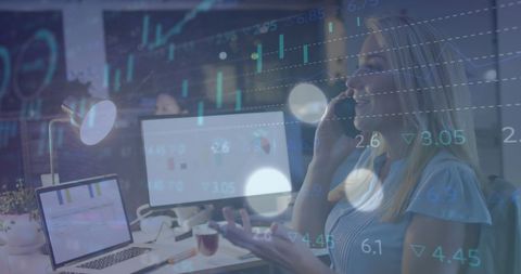 Businesswoman analyzing data and communicating in modern office