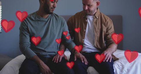 Diverse Male Couple Celebrating Love With Valentine's Day Hearts