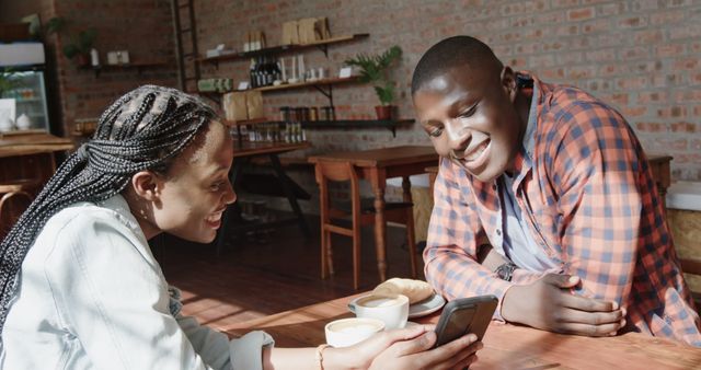 Friends Talking and Smiling Over Coffee in Café - Download Free Stock Images Pikwizard.com