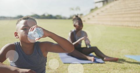 Children Enjoying Outdoor Yoga Session and Staying Hydrated - Download Free Stock Images Pikwizard.com