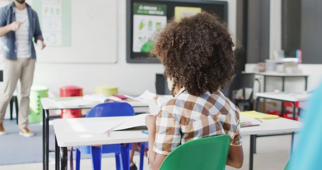 Student in Classroom Paying Attention to Teacher Lesson - Download Free Stock Images Pikwizard.com