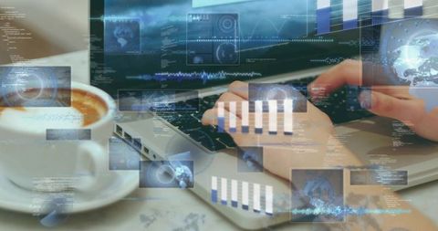 Typing hands coding on laptop with coffee cup and data overlays showing analytics