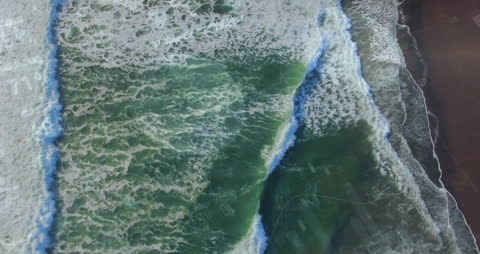 Aerial View Merging Analytics with Ocean Waves and Green Land