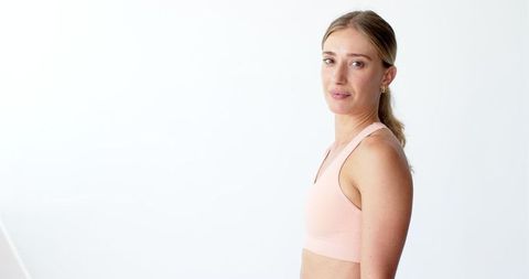 Fit Caucasian Yoga Instructor in Light Sportswear