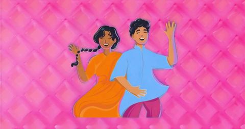 Vibrant indian couple dancing in sari and kurta on diamond pink backdrop celebrating festival