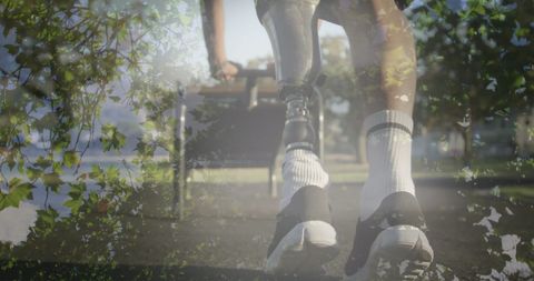 African American Man with Prosthetic Leg Stretching Outdoors