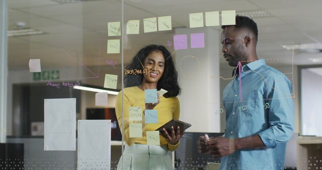 Business Colleagues Analyzing Data on Transparent Board in Office - Download Free Stock Images Pikwizard.com