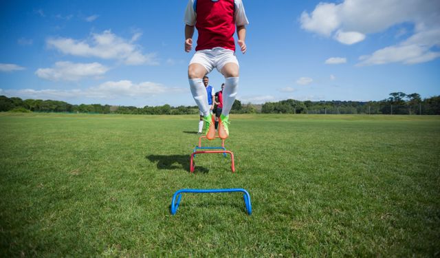 Soccer players practicing on obstacle - Download Free Stock Photos Pikwizard.com