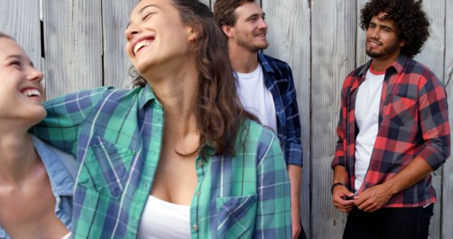 Young Friends Laughing Outdoors, Casual Clothing - Download Free Stock Images Pikwizard.com