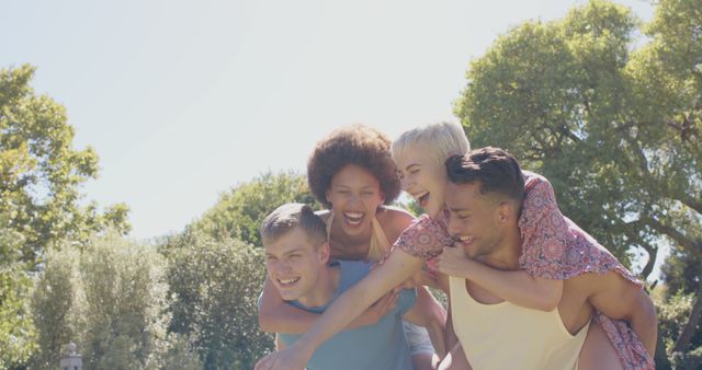 Group of Friends Having Fun Piggybacking Outdoors - Download Free Stock Images Pikwizard.com