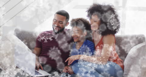 African American Family Smiling Using Laptop with Virus Overlay