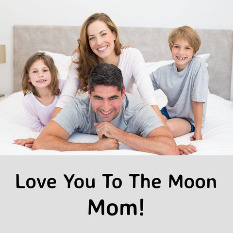 Happy family relaxing on bed celebrating mother's day
