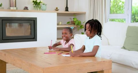Children Drawing at Home Together in Comfortable Living Room