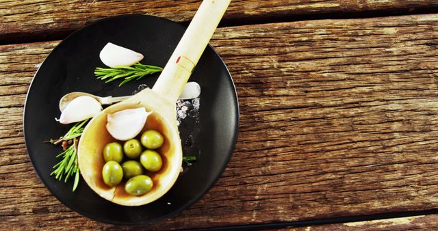 Mediterranean Olives and Garlic on Rustic Wooden Table - Download Free Stock Images Pikwizard.com