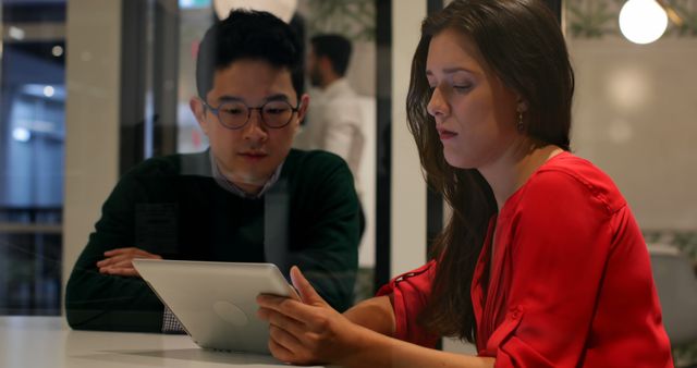 Two Business Colleagues Working Together on Tablet in Modern Office - Download Free Stock Images Pikwizard.com