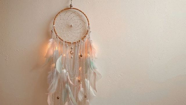 White Dreamcatcher with Feathers and LEDs on Neutral Background