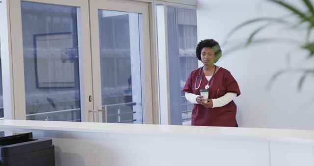 Nurse in Medical Uniform Standing in Hospital Corridor - Download Free Stock Images Pikwizard.com