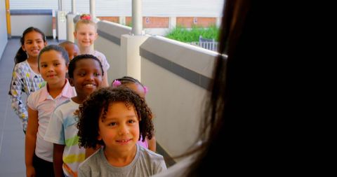Diverse Group of Schoolchildren Queuing with Teacher - Download Free Stock Images Pikwizard.com