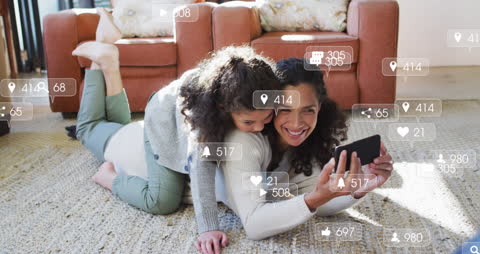 Mother and Daughter Engaging with Social Media on Smartphone