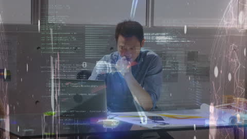 Businessman Analyzing Data with Futuristic Virtual Interface in Office