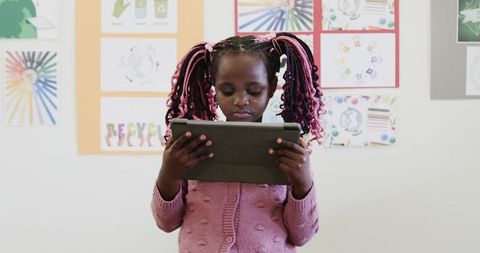 Young Girl Studying with Tablet in Creative Classroom Ambiance