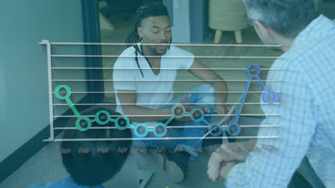 Diverse Team Discussing Financial Graphs Amid Business Meeting