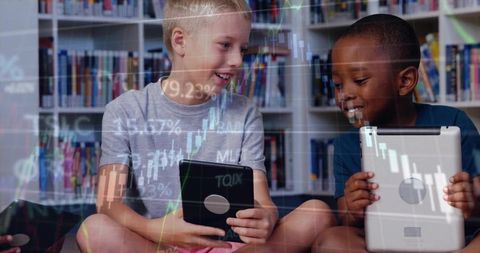 School children engaging with digital financial data in library