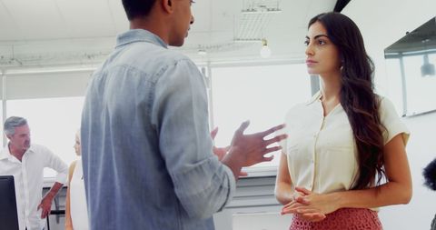 Diverse Team Discussion in Modern Office Space