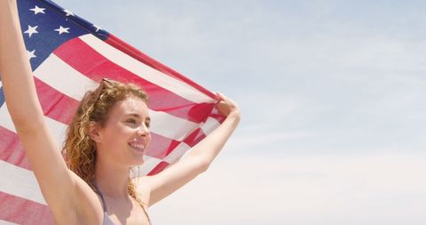 Joyful Woman Holding American Flag on Beach - Download Free Stock Images Pikwizard.com