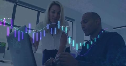 Business professionals analyzing financial data on laptop screen