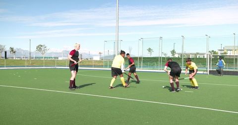 Energetic field hockey match showcase on turf