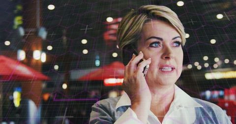 Caucasian Businesswoman Engaged in Technology Conversation