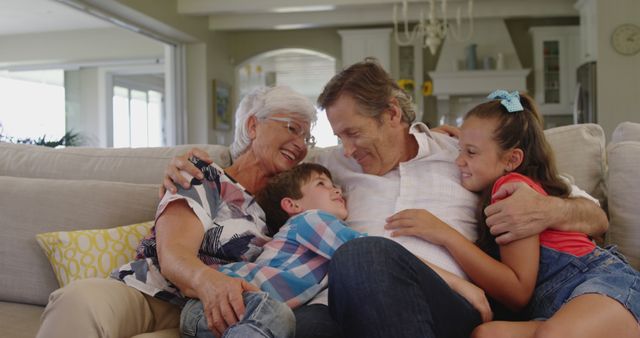 Happy Multi-Generational Family Hugging and Laughing on Couch - Download Free Stock Images Pikwizard.com