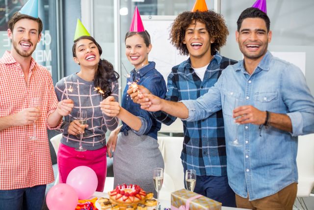 Happy executives celebrating their colleagues birthday - Download Free Stock Photos Pikwizard.com