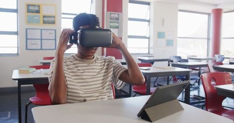 Teen Using Virtual Reality Headset in Modern Classroom