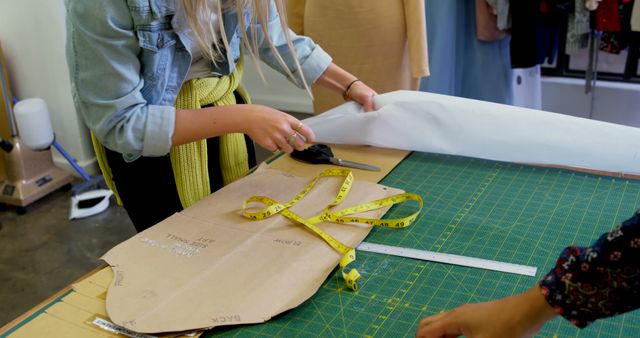 Fashion Designer Cutting Fabric for New Garment Creation - Download Free Stock Images Pikwizard.com