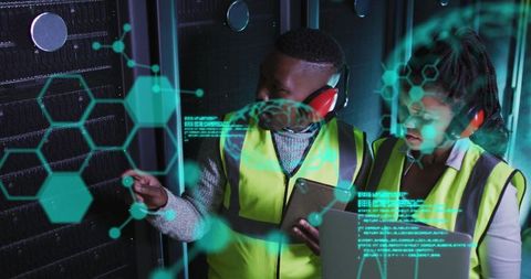Technicians analyzing holographic data in modern server room