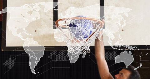 Slam dunk reaching rim under backboard with global network overlay and athletic focus