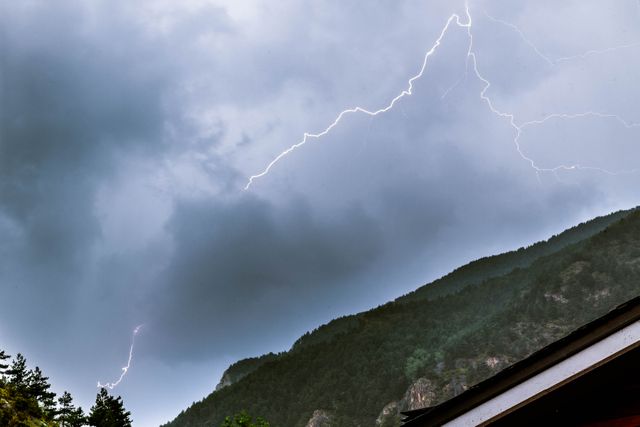 Dramatic Lightning Strikes Over Mountain Landscape - Download Free Stock Photos Pikwizard.com