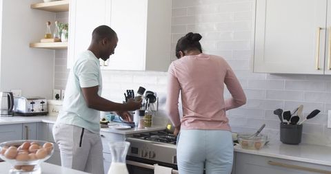 Couple Preparing Breakfast Together in Modern Kitchen